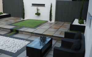 Modern landscaped garden using concrete, timber screening and structured planting.