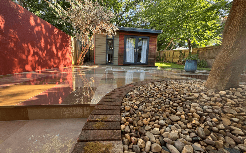 Completed Devon garden with patio, planting and garden room.
